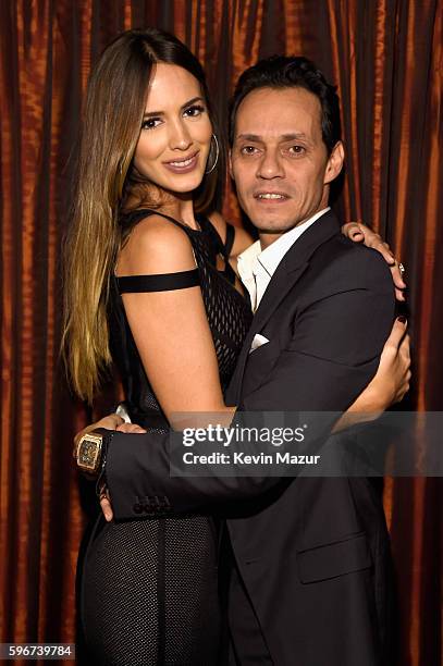 Shannon De Lima and Marc Anthony pose backstage at Radio City Music Hall on August 27, 2016 in New York City.