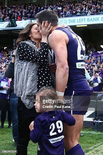 Matthew Pavlich of the Dockers is greeted by his wife Lauren and children Jack and Harper before playing his final game during the round 23 AFL match...