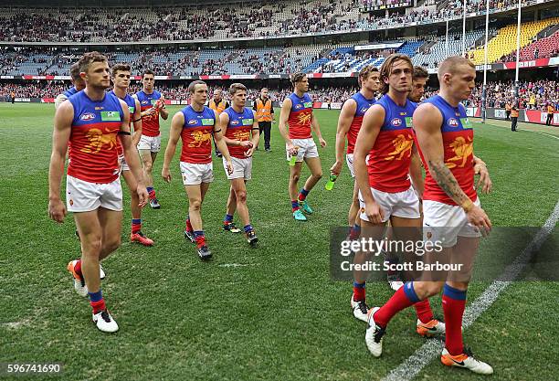 The Lions leave the field after losing the round 23 AFL match between the St Kilda Saints and the Brisbane Lions at Etihad Stadium on August 28, 2016...