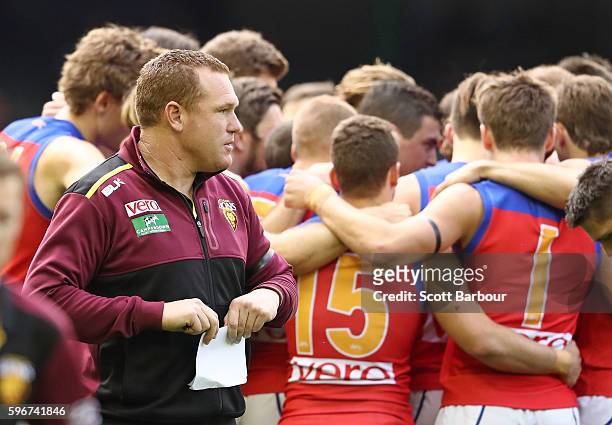 Lions head coach Justin Leppitsch speaks to his team during a quarter time break during the round 23 AFL match between the St Kilda Saints and the...