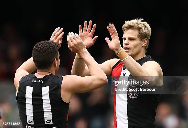 Nick Riewoldt of the Saints is congratulated by Leigh Montagna of the Saints after kicking a goal during the round 23 AFL match between the St Kilda...