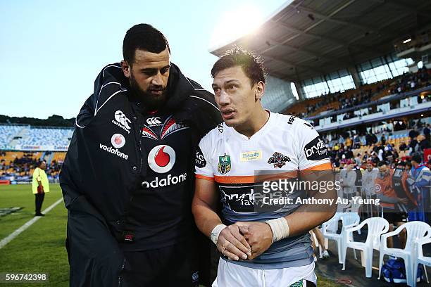 Elijah Taylor of the Tigers catches up with Ben Matulino of the Warriors after the round 25 NRL match between the New Zealand Warriors and the Wests...
