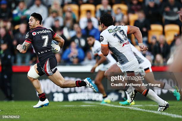 Shaun Johnson of the Warriors makes a break during the round 25 NRL match between the New Zealand Warriors and the Wests Tigers at Mount Smart...