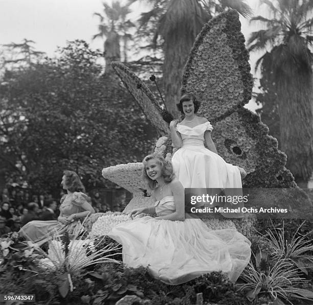 Young ladies ride on a butterfly float in the 1950 Rose Parade in Pasadena, California.