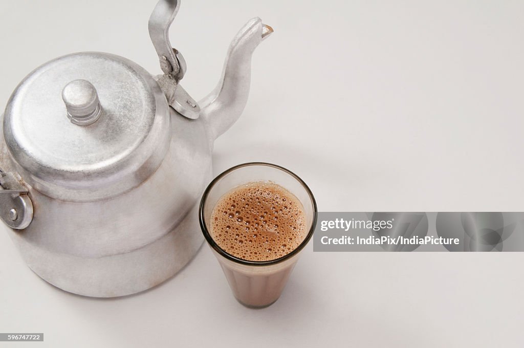 High Angle View Of Chai In Glass With An Old Fashioned Kettle Isolated Over  White Background High-Res Stock Photo - Getty Images