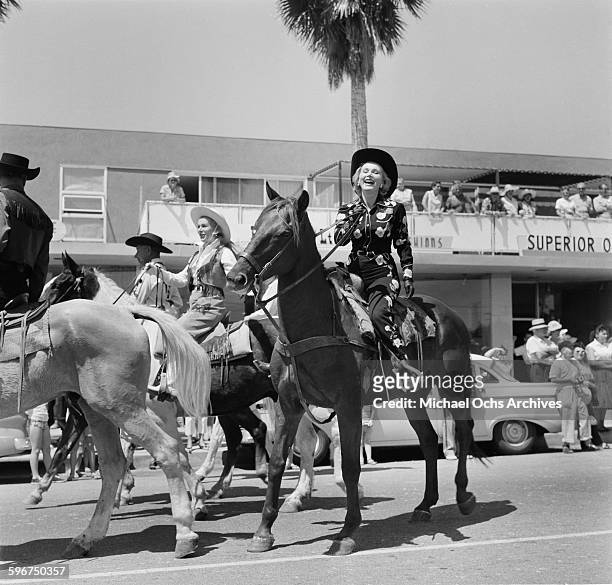 Women rides her western horse in the 1958 Rose Parade in Pasadena, California.