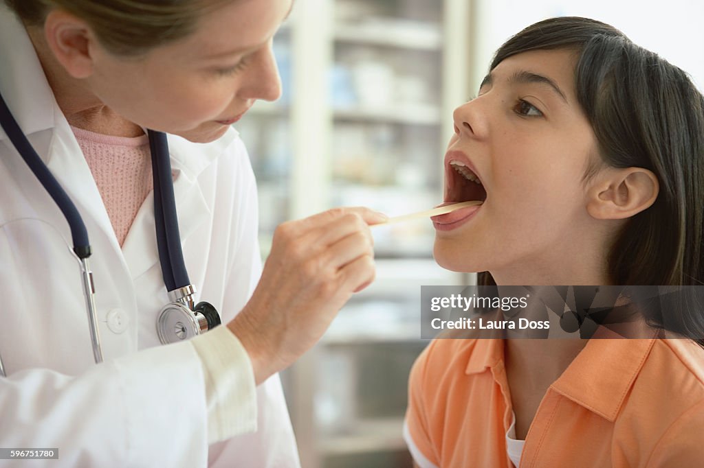 Doctor examining girl