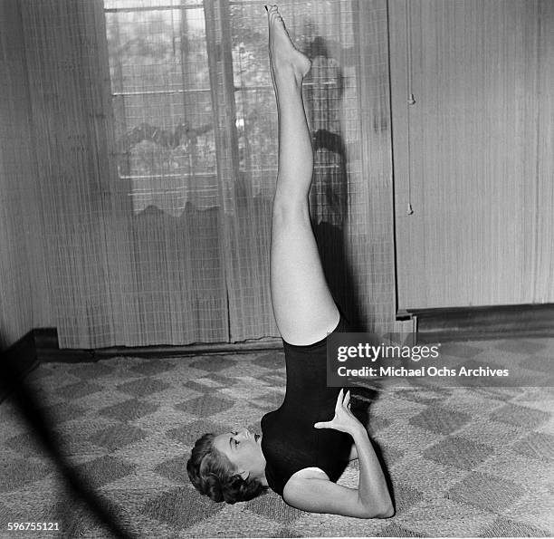 Student gets into a yoga position at Indra Devi Yoga Studio in Hollywood,California.