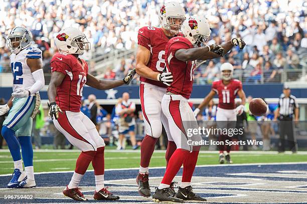 Arizona Cardinals tight end John Carlson and Arizona Cardinals wide receiver Jaron Brown celebrate a touchdown during a football game between the...