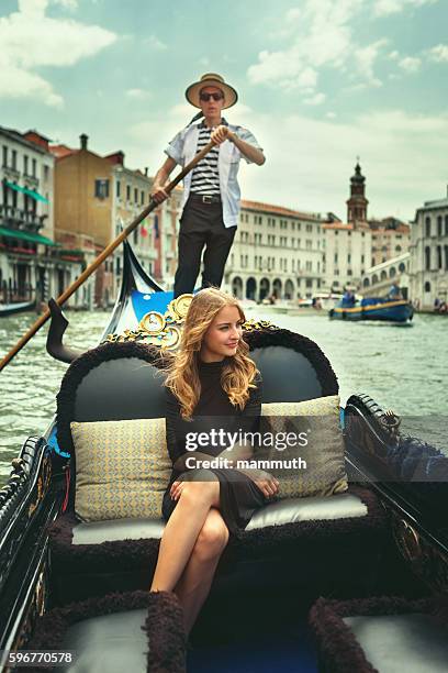 young woman in gondola tour in venice - venice gondola stock pictures, royalty-free photos & images