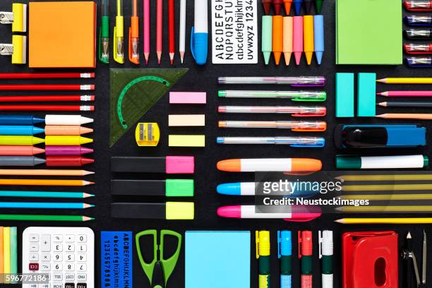 close-up of office and school supplies are arranged on blackboar - slate pencil stockfoto's en -beelden