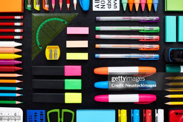 close-up of office and school supplies are arranged on blackboar - slate pencil stockfoto's en -beelden