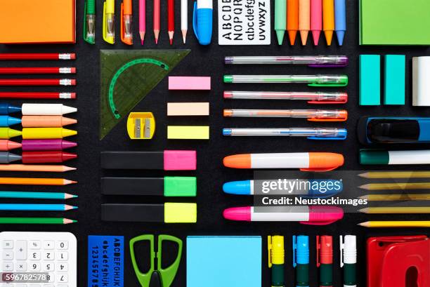 office and school supplies are arranged on blackboard - slate pencil stockfoto's en -beelden