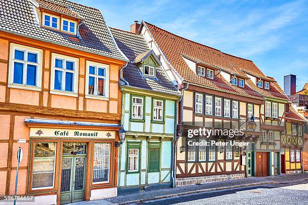 view of street and half-timbered houses - fachwerk stock-fotos und bilder