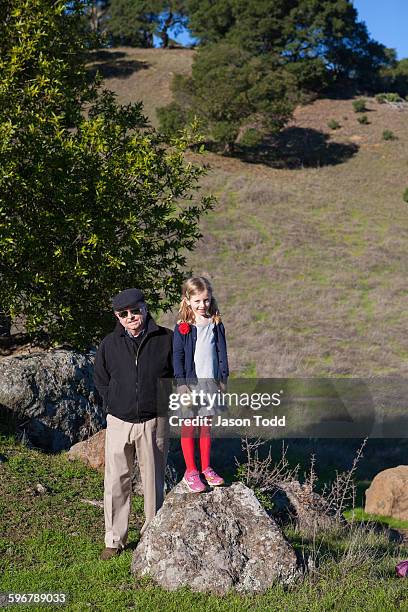 seven year old girl in nature with granddad - san pablo bay ストックフォトと画像