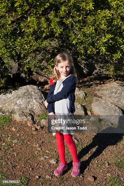 seven year old girl in nature posing with toy - san pablo bay ストックフォトと画像