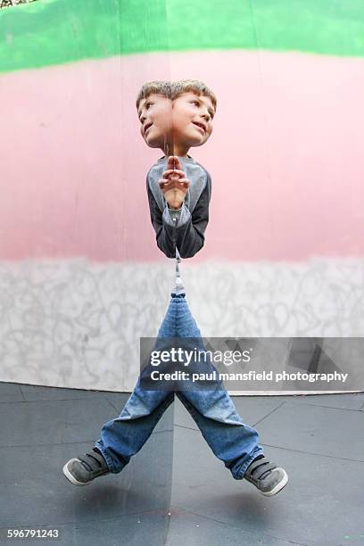 boy having fun with mirror symmetry - symmetry people stock pictures, royalty-free photos & images