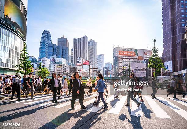 shinjuku shopping district, tokyo, japan - crosswalk stock pictures, royalty-free photos & images