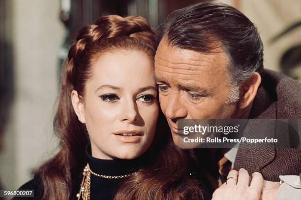 Italian actress Luciana Paluzzi pictured with English actor John Mills in a scene from the film 'A Black Veil for Lisa' in Italy on 15th March 1968.