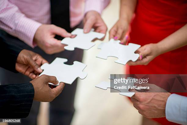 problem solving - 4 piece puzzle stockfoto's en -beelden