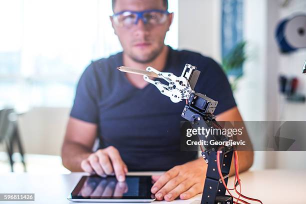 education and science - robot human hand stock pictures, royalty-free photos & images