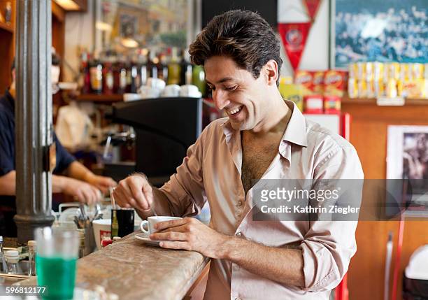 man having coffee at the bar, laughing - cultura italiana foto e immagini stock