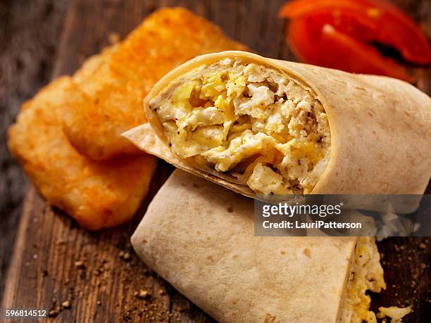 scrambled egg and cheese breakfast wrap - hash brown stock pictures, royalty-free photos & images