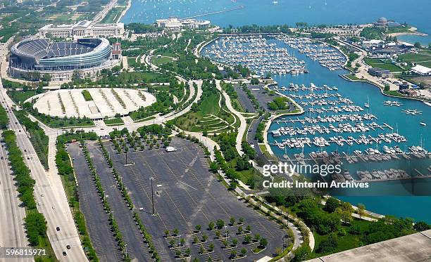 View, looking north at the Museum Campus with the Field Museum, Soldier Field, and the Shedd Aquarium in the upper left, and the Adler Planetarium in...