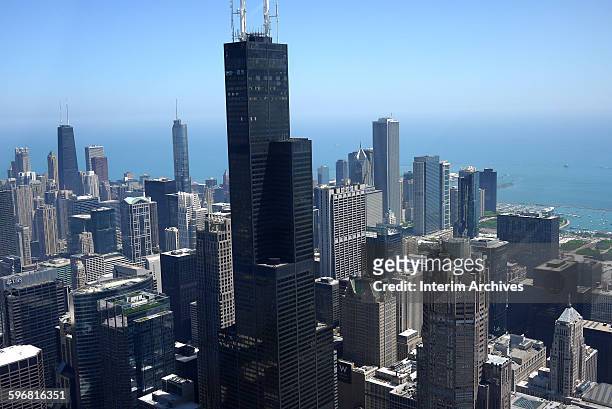 View, looking northeast at the downtown Chicago skyline, with the John Hancock on the left, the Trump Tower in center left, and the Willis Towers in...