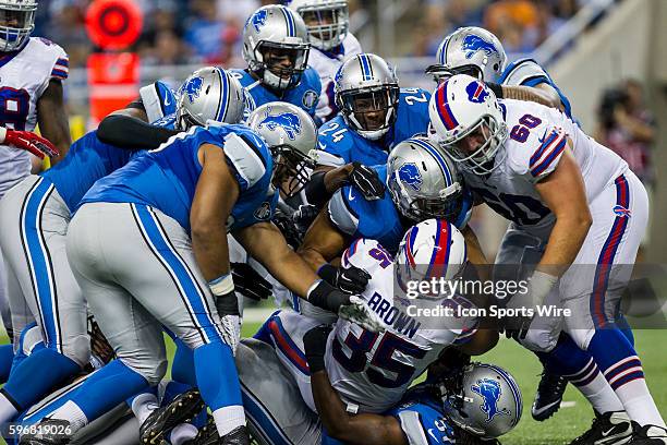 Buffalo Bills running back Bryce Brown is gang tackled by the Detroit Lions defense during game action between the Buffalo Bills and Detroit Lions...