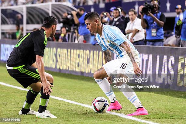 Mexico forward Israel Jimenez and Argentina defender Marcos Rojo battle for the ball during the international friendly soccer match between the...
