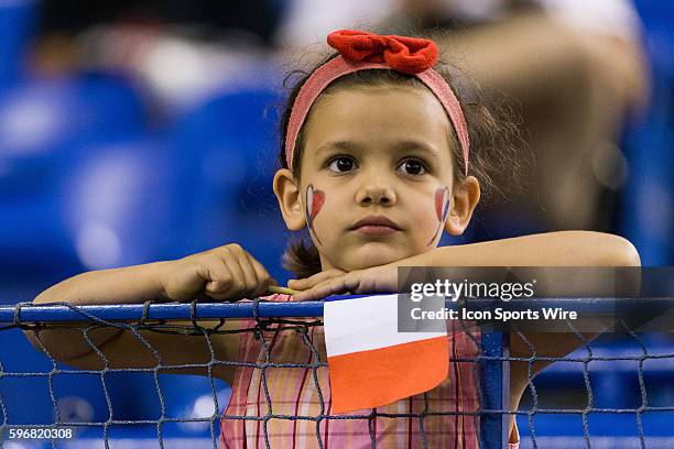 Young France fan looks at the warm-up prior to the 2015 FIFA Women's World Cup Quarter final match between Germany and France at the Olympic Stadium...