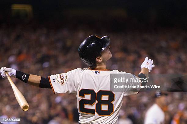 San Francisco Giants catcher Buster Posey at bat at connecting with the ball in the 5th inning, during game 4 of the World Series between the San...