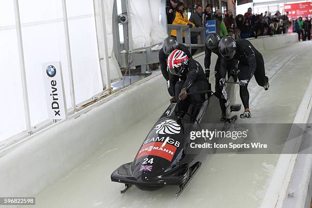 The Great Britain 2 bobsled driven by Lamin Deen with sidepushers Keith McLaughlin and Justin Oro-Campos, and brakeman Andrew Matthews slides on the...