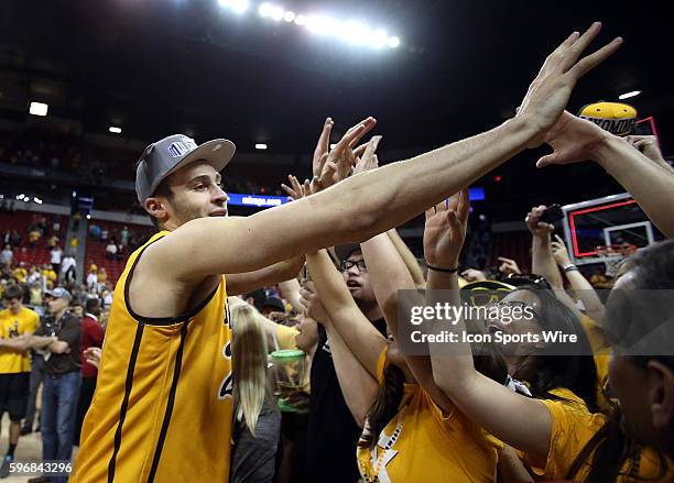 Wyoming Cowboys forward Larry Nance Jr. #22 celebrates with fans after the second half of the Mountain West Men's Basketball tournament game between...