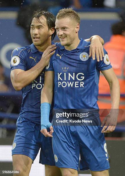 Jamie Vardy and Shinji Okazaki celebrate after Vardy opened the scoring in Leicester City's 2-1 win at home to Swansea in the English Premier League...