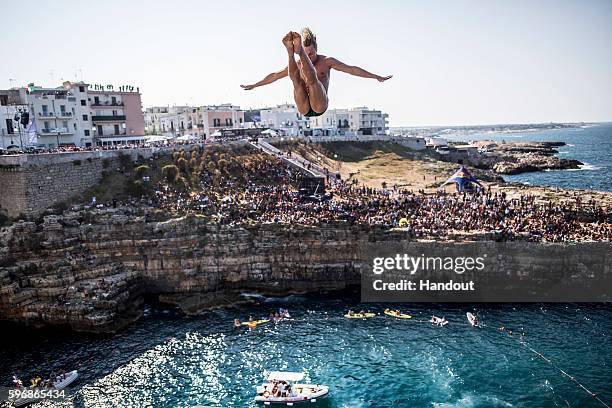 In this handout image provided by Red Bull, Kris Kolanus of Poland dives from the 27 metre platform during the first competition day of the fifth...