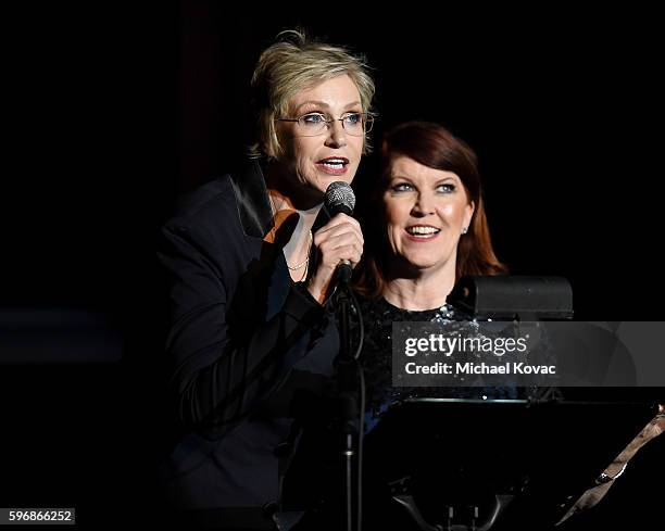 Actress Jane Lynch and actress Kate Flannery perform onstage at the Festival of Arts Celebrity Benefit Concert and Pageant on August 27, 2016 in...