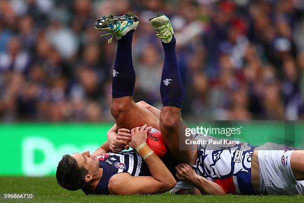 Matthew Pavlich of the Dockers marks the ball against Fletcher Roberts of the Bulldogs during the round 23 AFL match between the Fremantle Dockers...