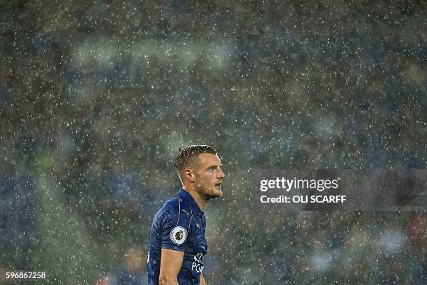 Leicester City's English striker Jamie Vardy in the rain during the English Premier League football match between Leicester City and Swansea City at...