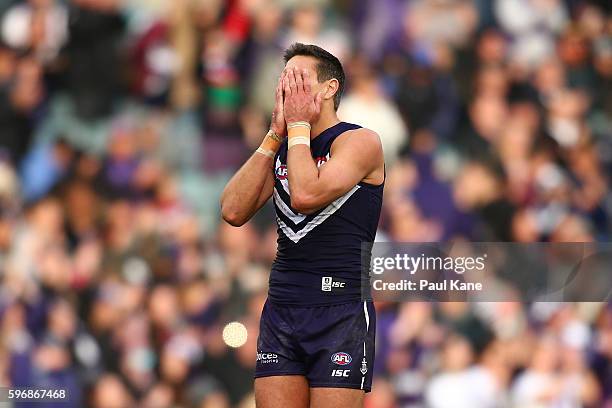 Matthew Pavlich of the Dockers reacts after playing his final game during the round 23 AFL match between the Fremantle Dockers and the Western...