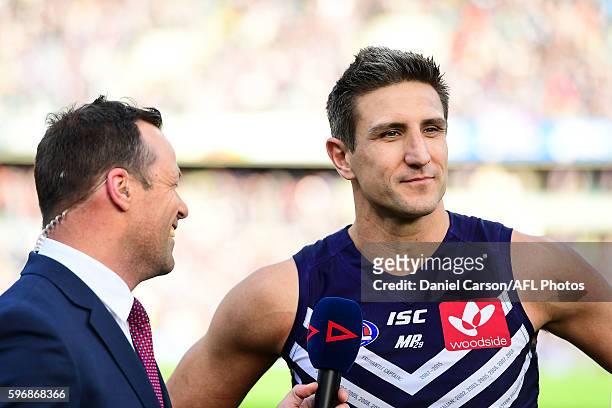 Matthew Pavlich of the Dockers is interviewed on the field after the win during the 2016 AFL Round 23 match between the Fremantle Dockers and the...