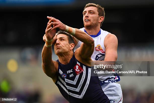 Matthew Pavlich of the Dockers contests a mark with Fletcher Roberts of the Bulldogs during the 2016 AFL Round 23 match between the Fremantle Dockers...