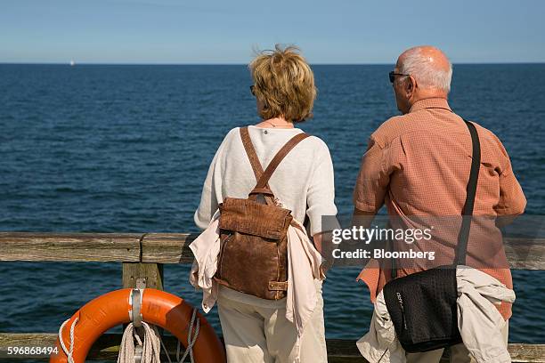 Pensioners look out towards the Baltic Sea at the beachfront in Sellin, Ruegen Island, Germany, on Saturday, Aug. 27, 2016. Germany's Bundesbank said...