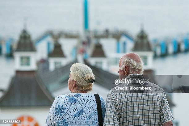 Pensioners look out towards the Baltic Sea at the beachfront in Sellin, Ruegen Island, Germany, on Saturday, Aug. 27, 2016. Germany's Bundesbank said...