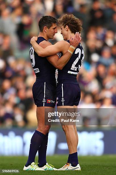 Matthew Pavlich and Chris Mayne of the Dockers embrace after winning the round 23 AFL match between the Fremantle Dockers and the Western Bulldogs at...