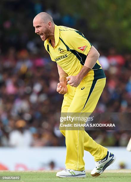 Australian cricketer John Hastings celebrates after dismissing Sri Lankan cricketer Thisara Perera during the third One Day International cricket...