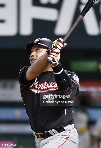 Tadahito Iguchi hits a tiebreaking sacrifice fly in the eighth inning of the Lotte Marines' 7-5 come-from-behind victory over the SoftBank Hawks at...