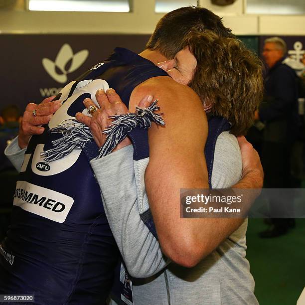 Matthew Pavlich of the Dockers hugs his mum Jan after playing his 353rd and final game during the round 23 AFL match between the Fremantle Dockers...