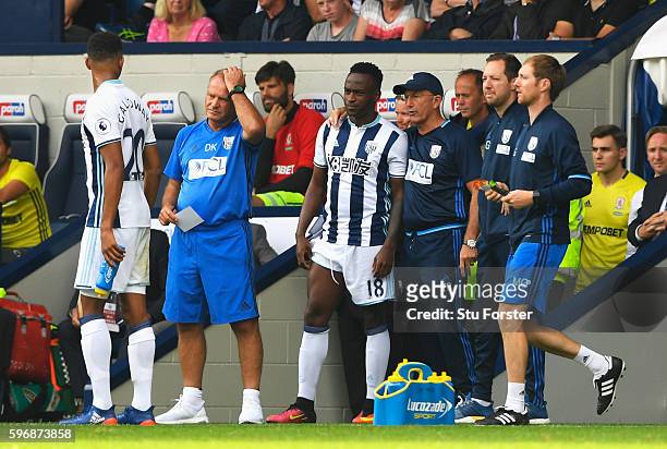 Tony Pulis, Manager of West Bromwich Albion prepares to bring on Saido Berahino as a substitute during the Premier League match between West Bromwich...